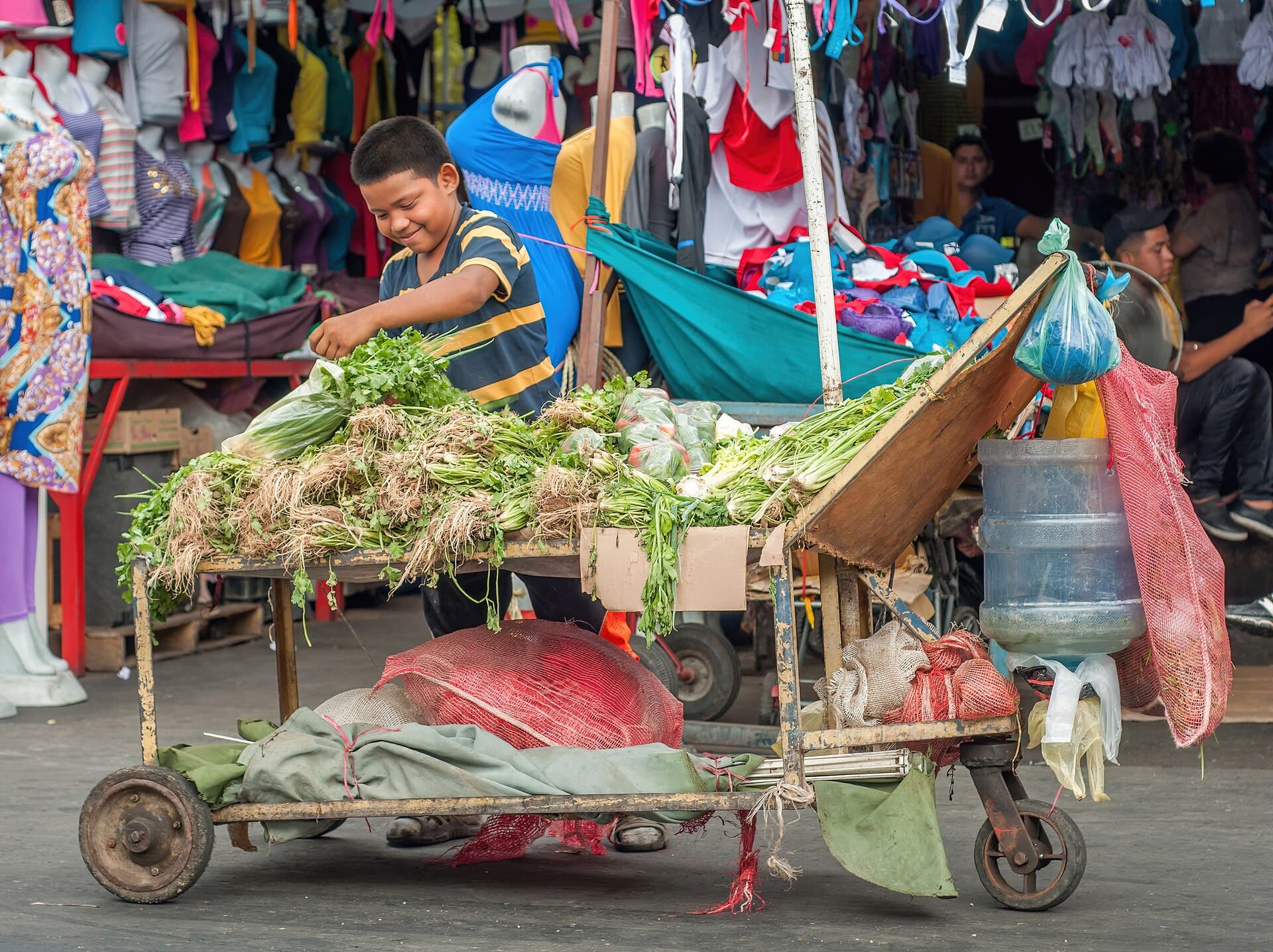 Child working selling vegetables in downtown Maracaibo